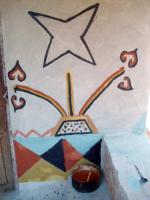 Abstract flower mural on village house